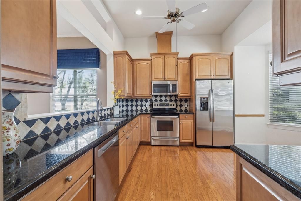 Large kitchen with solid wood cabinets and granite counter tops