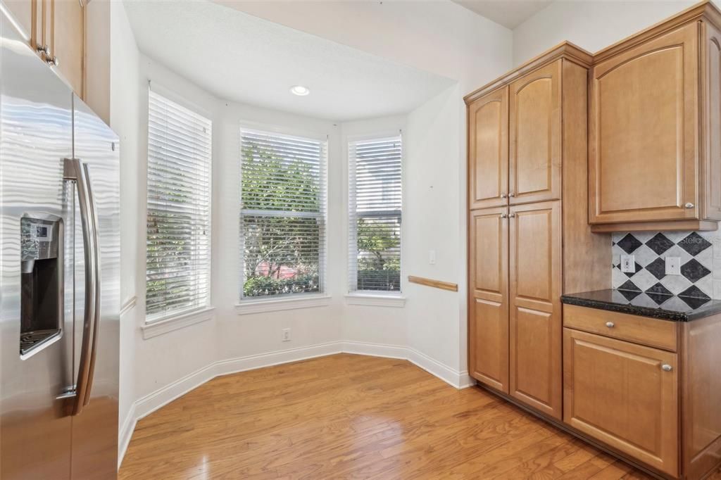 breakfast nook with custom cabinetry/pantry