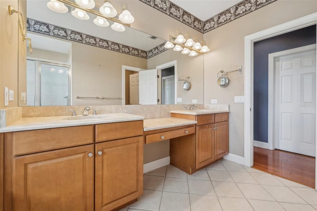 Master bath with double sinks and vanity