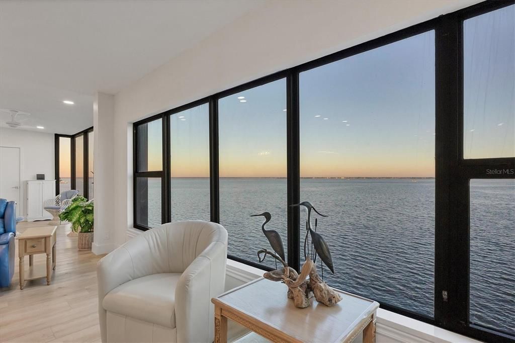 Living room demonstrating unending dawn view of Charlotte Harbor