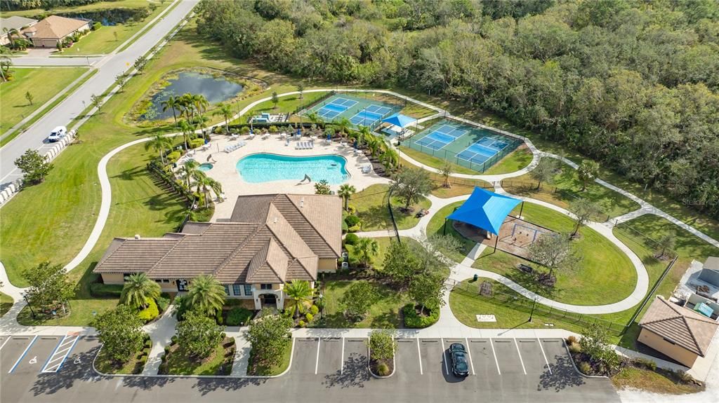 Clubhouse pool and spa with a playground and pickleball courts