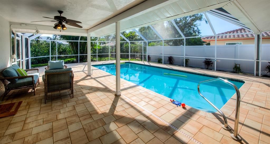 The 10x25 covered lanai has 2 ceiling fans and is the perfect place relax and read your favorite novel poolside.