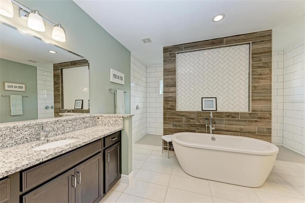 Ensuite bathroom with dual sink areas.