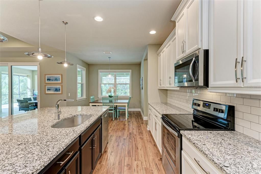 Kitchen looking to the eat-in informal dining area.