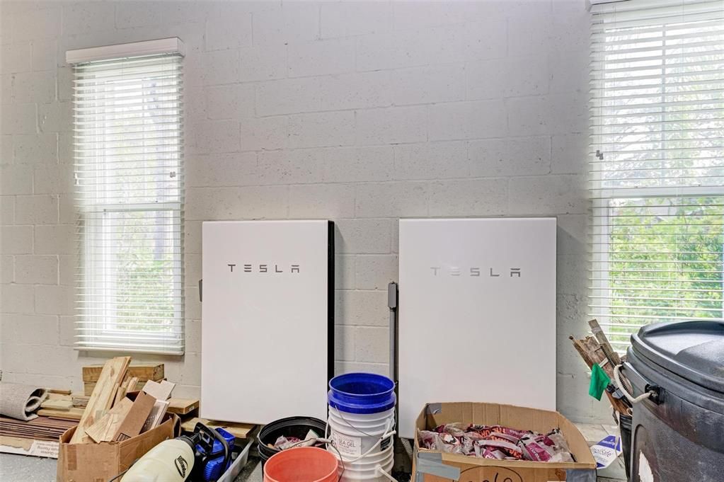 2 Tesla Powerwall Backup Power in garage that power entire house and pool during power outages.