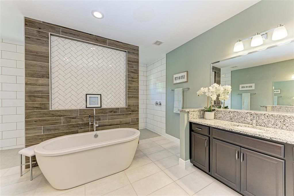 Ensuite bathroom with dual sink areas.