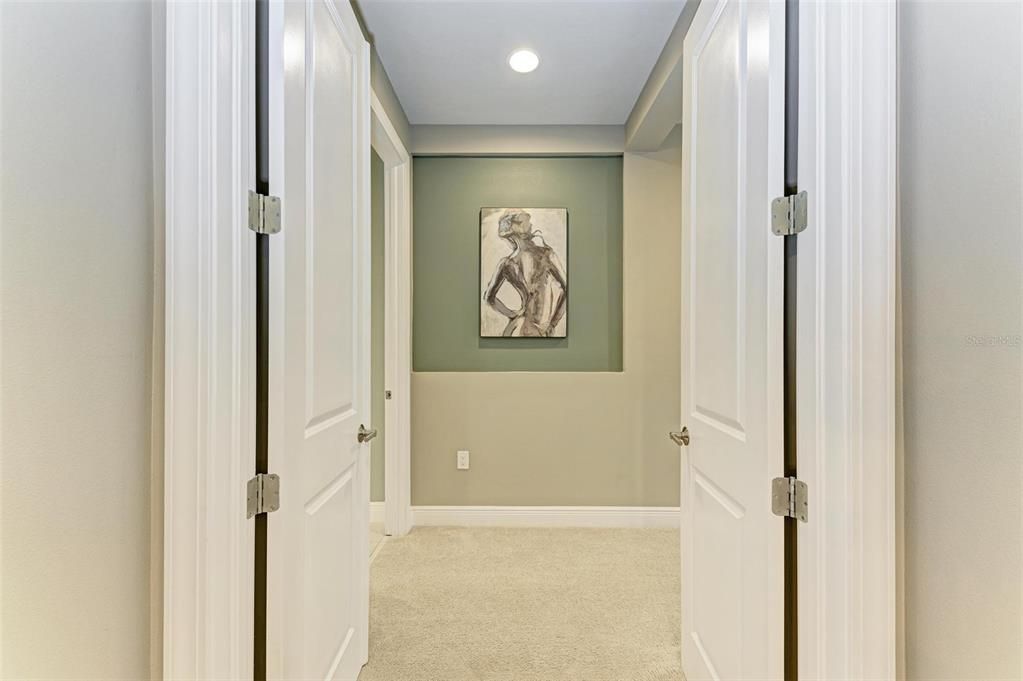 Double doors leading to primary bedroom.