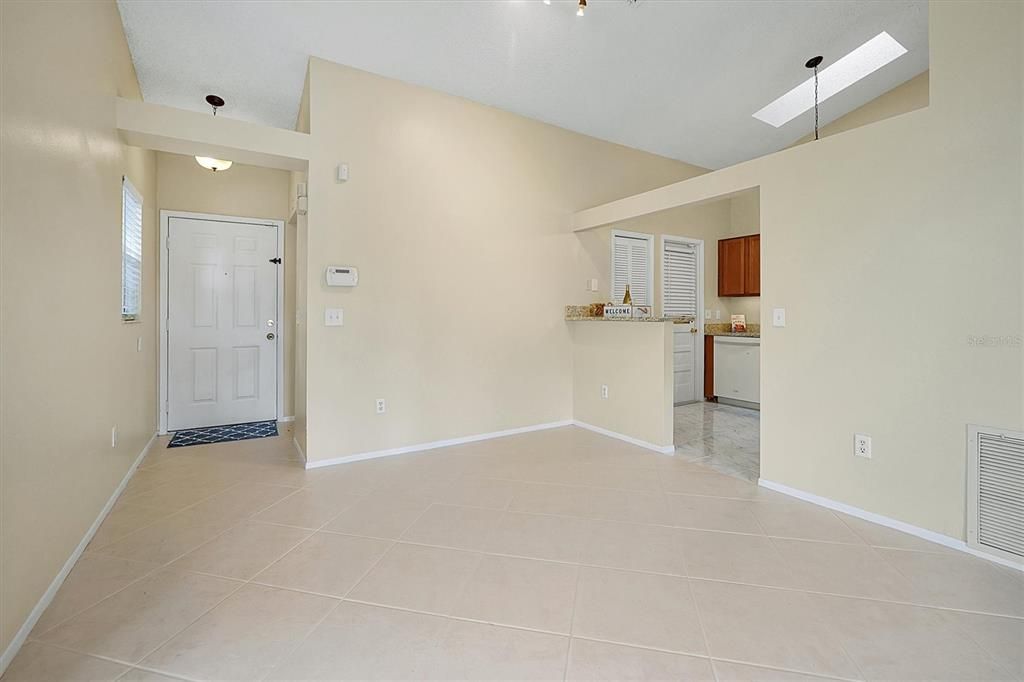 View from Living room to dining room and front entry foyer