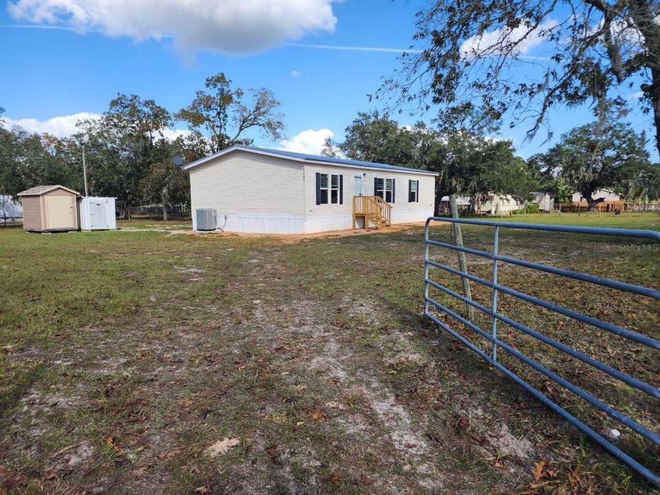 5105 S. Barker Point is fully fenced with a farm gate entry.