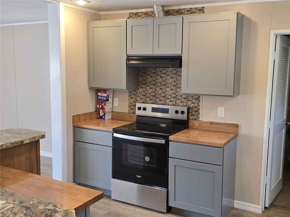 New cabinets, counters, flooring, and appliances.