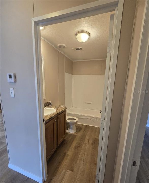 Bathroom 2 includes a tub/shower combo.