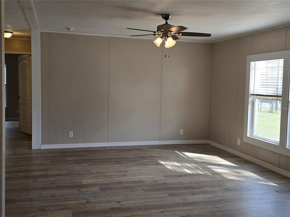 Walk into the spacious living room located at the front of the home.