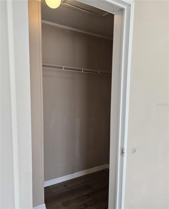 Primary bedroom walk-in closet