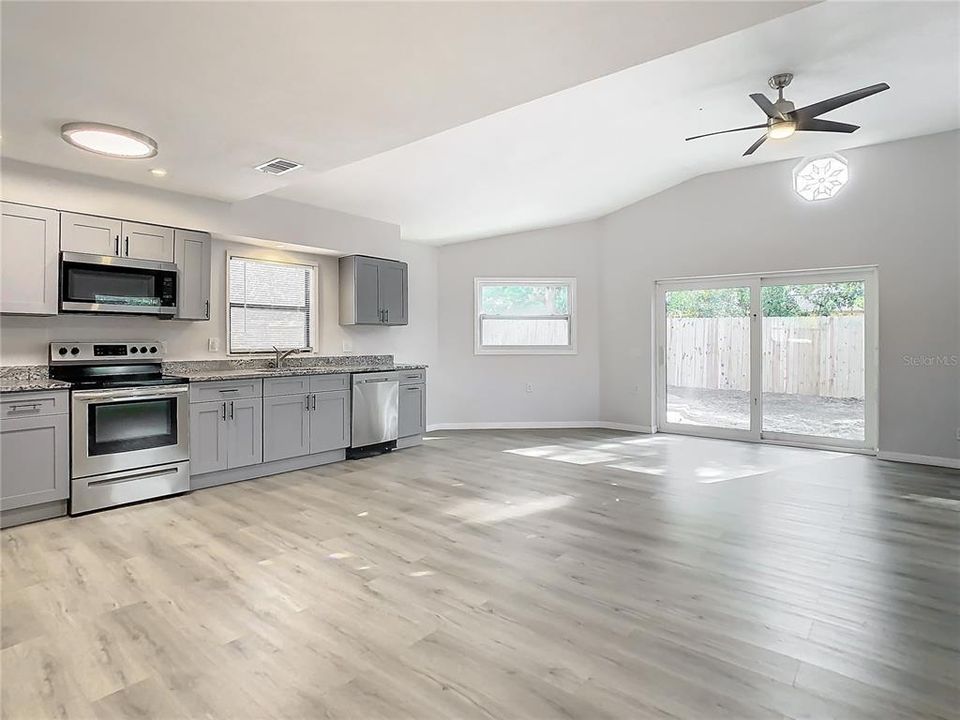 Kitchen -Dining Area - Family Room - Sliders to Pool Area