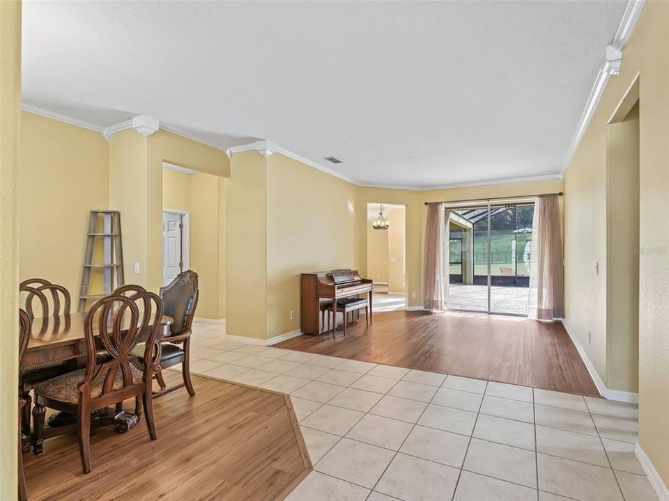 DINING ROOM/ LIVING ROOM WITH NEWER LUXURY VINYL PLANK FLOORING