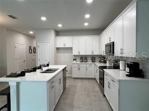 Kitchen with Big Island and Lots of Cabinet Space (photo of model home)