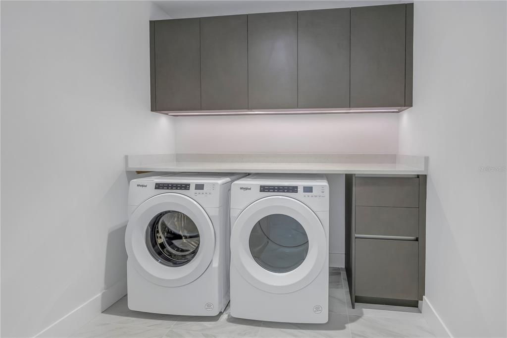 Convenient laundry room and additional storage