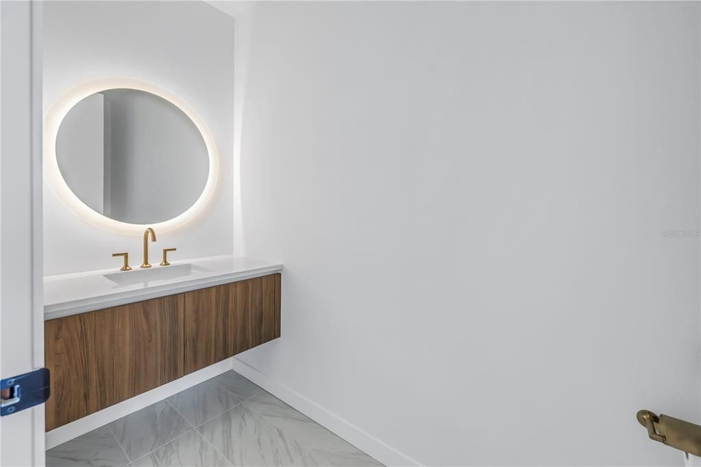 Primary bathroom with backlit mirror