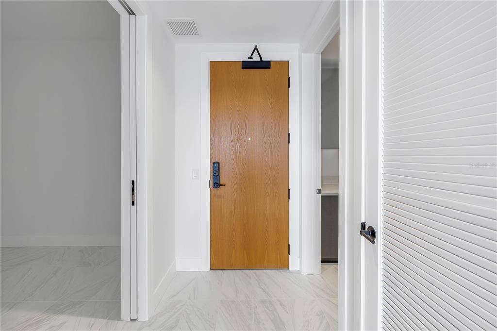 Looking back towards entry with large den on the left and huge laundry room to the right