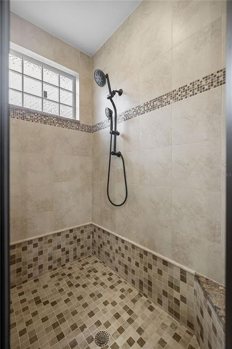 Primary Shower with corner bench