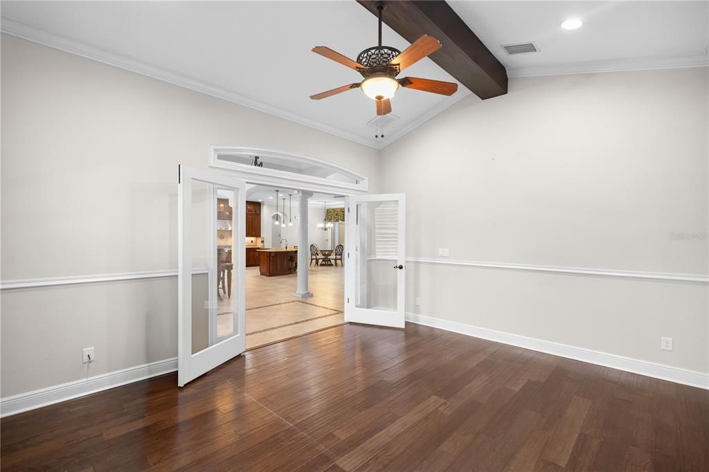 Office with exposed wood beam