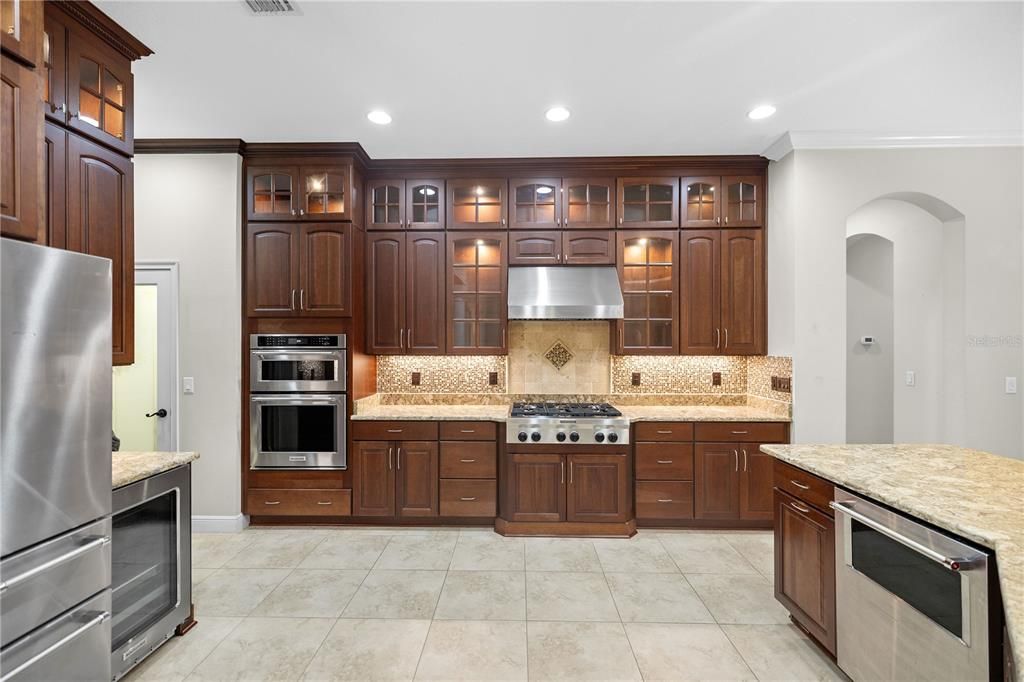 Chef's Kitchen with custom wood cabinets and lighting