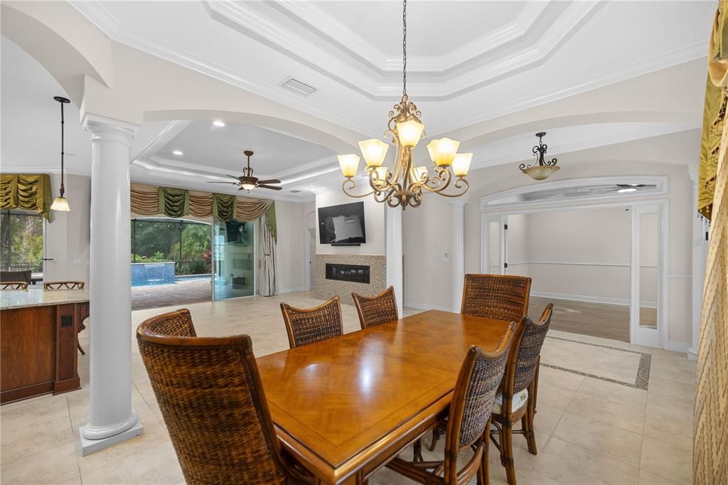 Dining room / living room combo with custom pillars and tray ceiling's