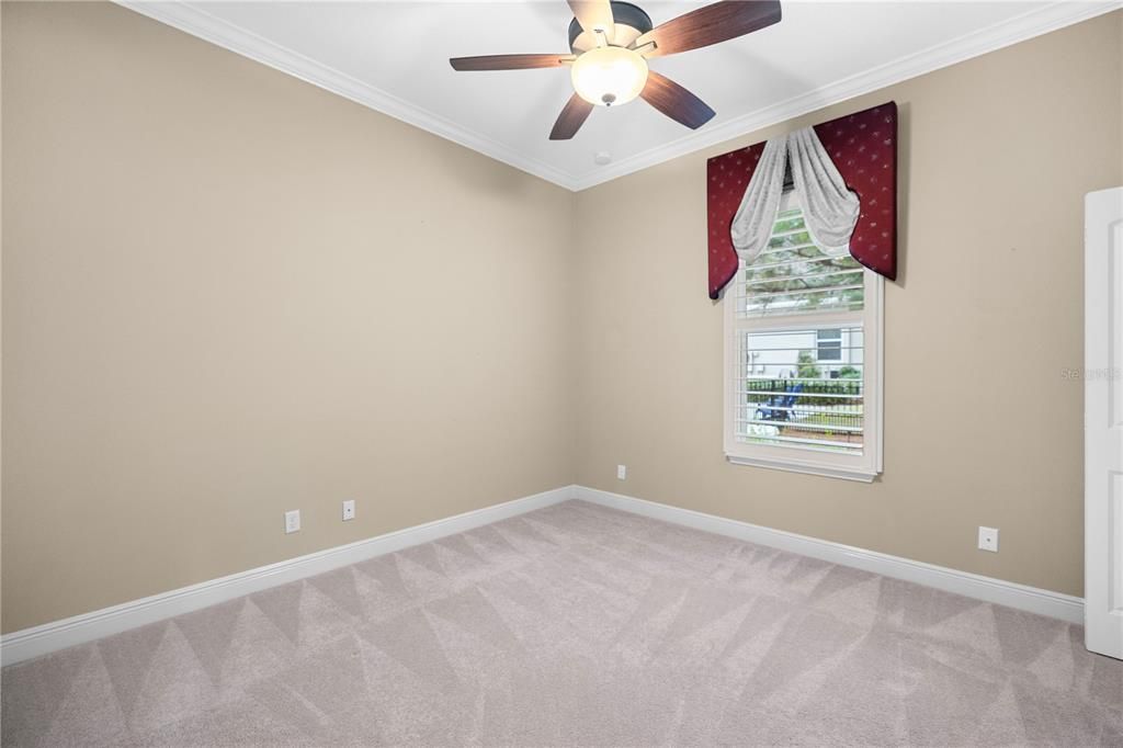 Guest bedroom 3 with Custom Cornice boards & Plantation Shutters