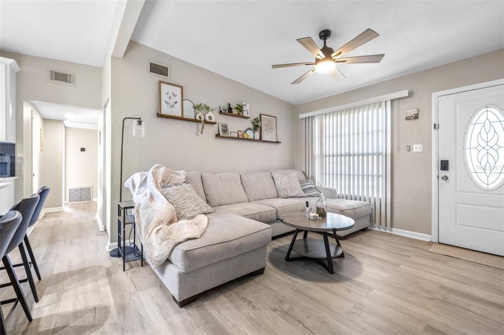 hallway leads to 3 bedrooms and bathroom