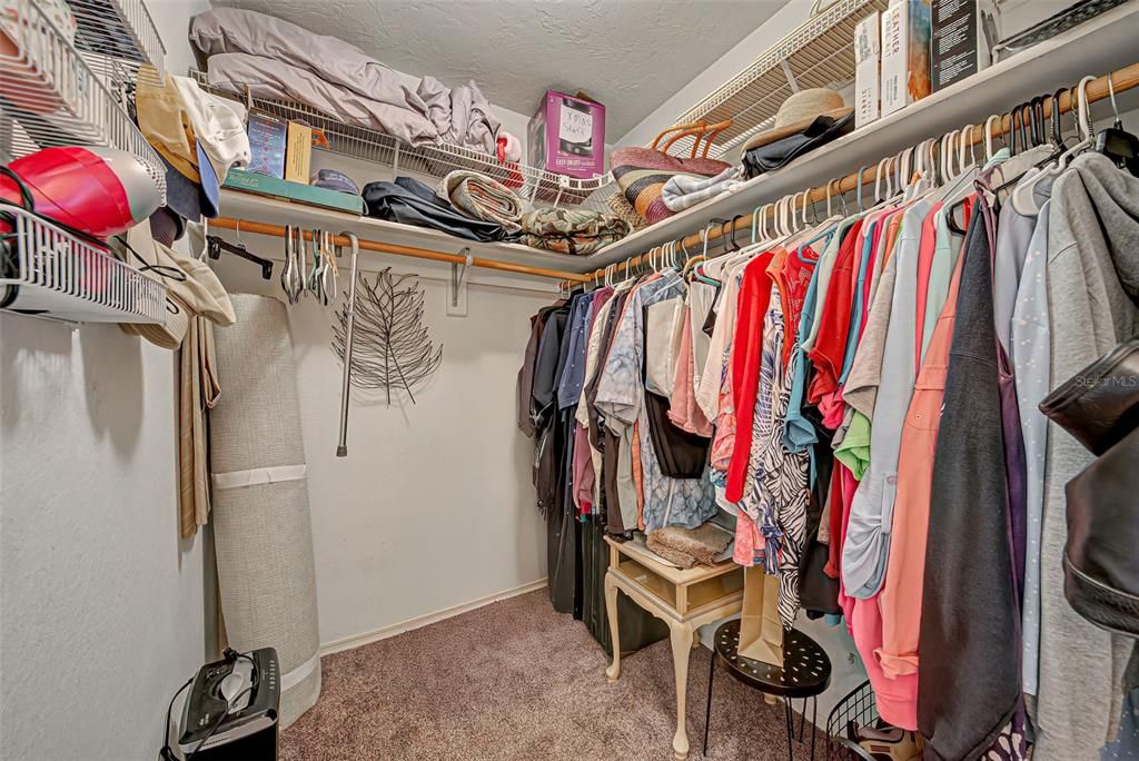 Large walk-in closet for primary bedroom.