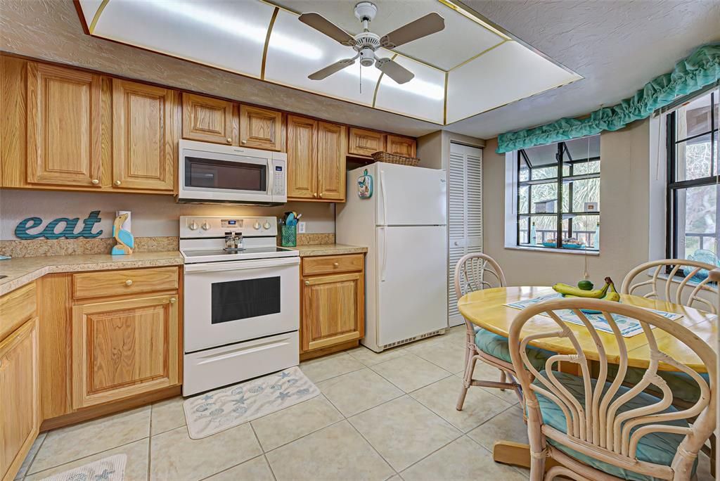 Nice and light - cheery kitchen with great cabinet and counter space.