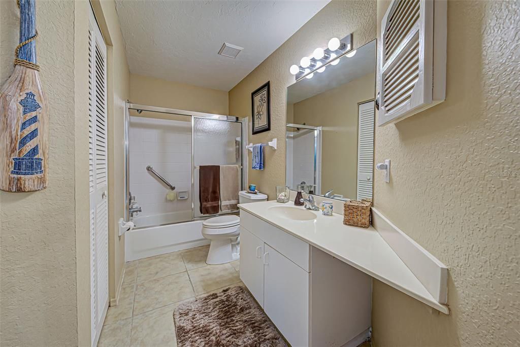 Guest bathroom with tub/ shower.