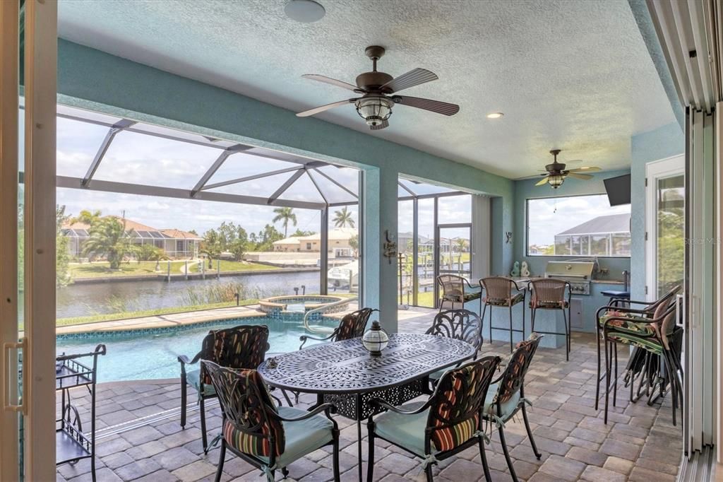 Summer Kitchen with Granite Bar, Sink, Grill, Mini Fridge, and Ice Maker