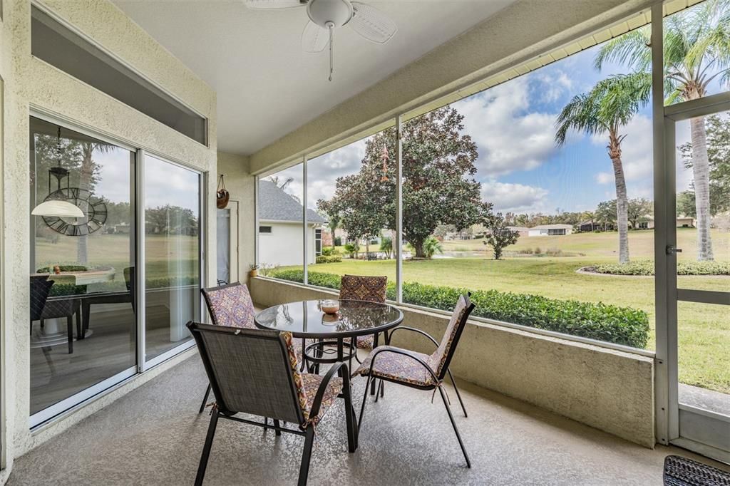 Relax on your screened lanai under roof with view of pond and serene fountain!