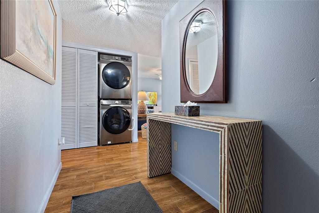 Entry hall with laundry closet.