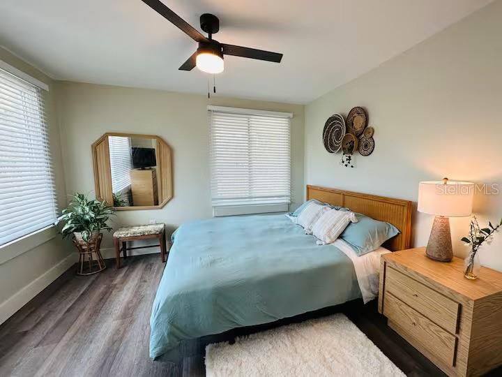 Main bedroom with a ceiling fan.