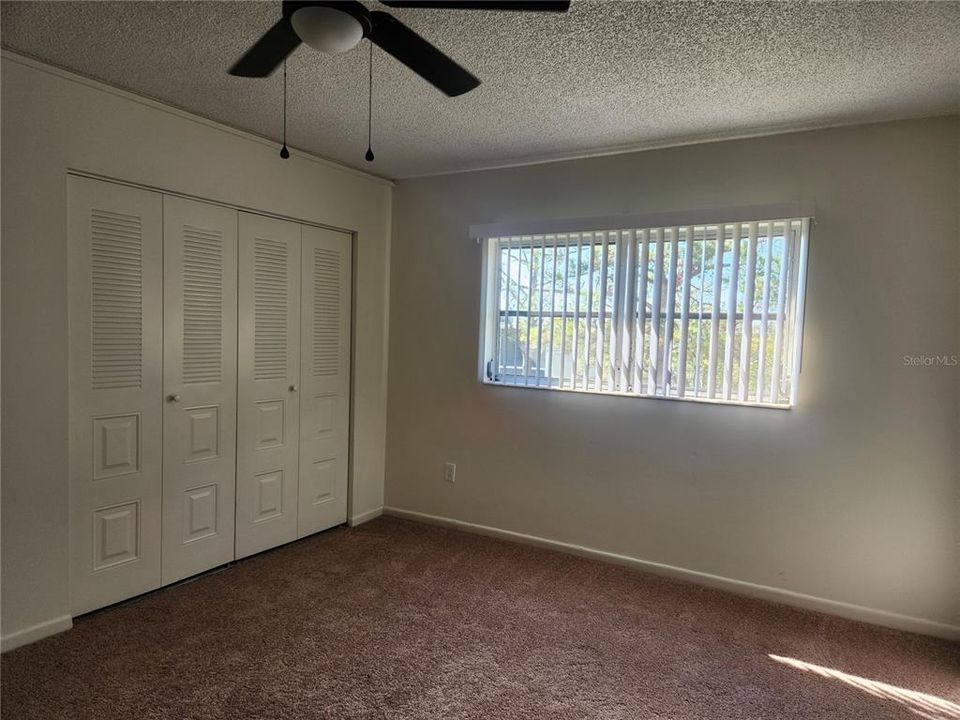 Bedroom has two good sized closets.  New lighted ceiling fan and blinds.