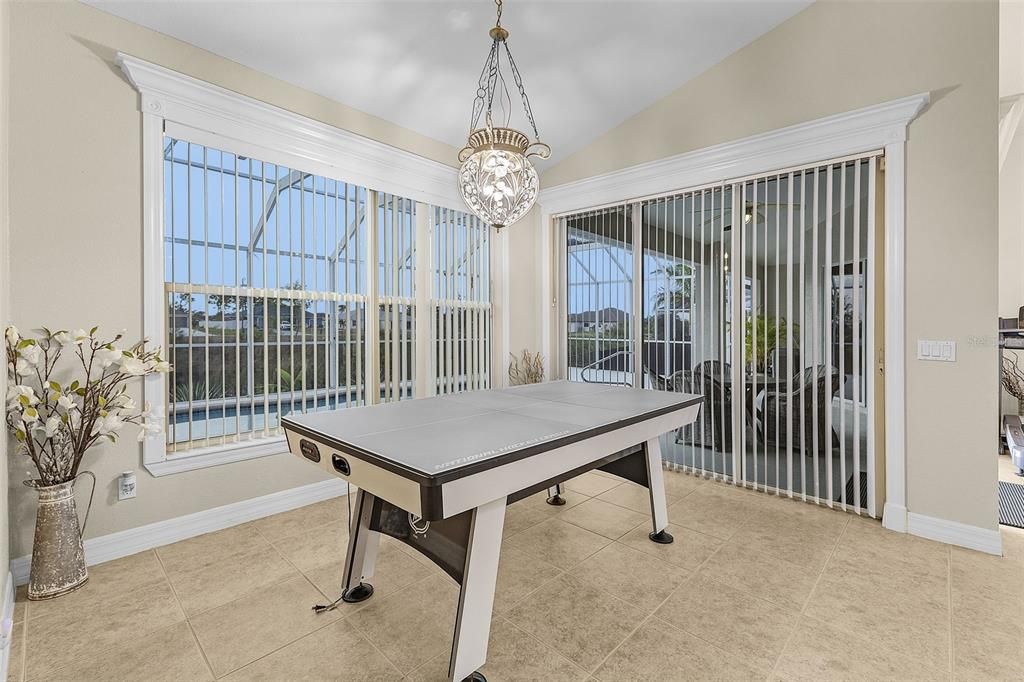 BRIGHT DINING AREA WITH SLIDERS TO PATIO