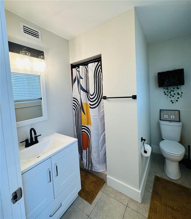 Bathroom in the smaller unit.