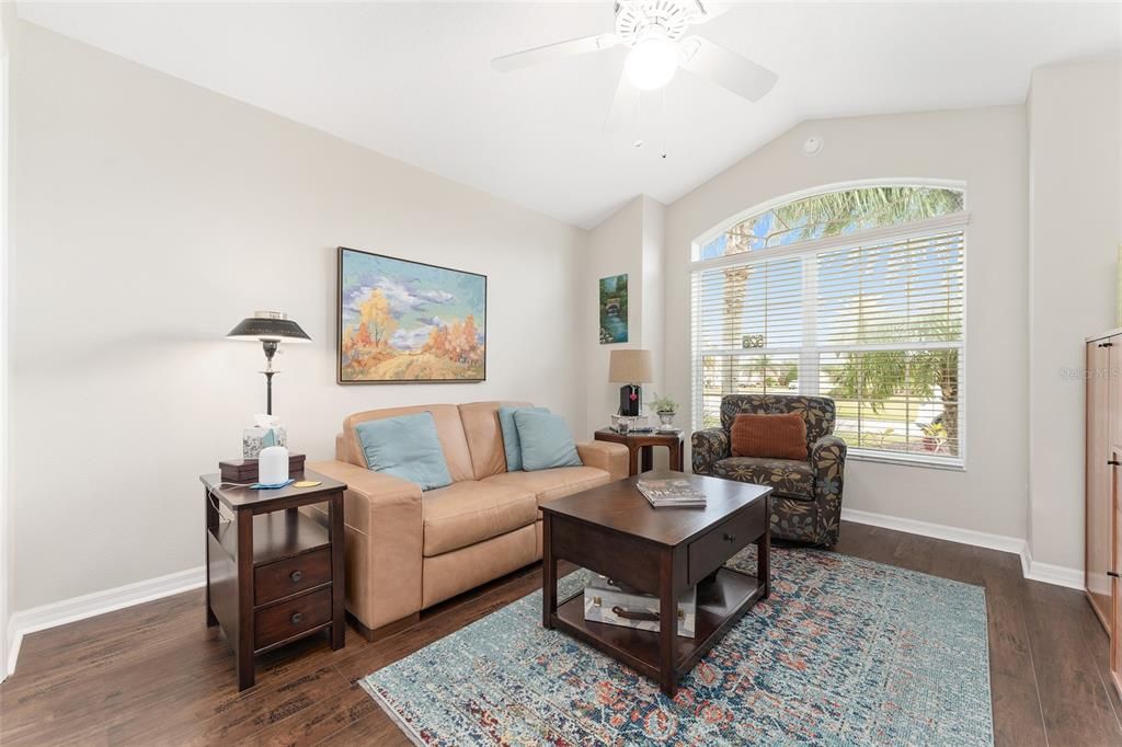 BEDROOM #2 boasts CATHEDRAL CEILING, double windows with transom, ceiling fan, CLOSET, and handsome WOOD LAMINATE flooring (2018)