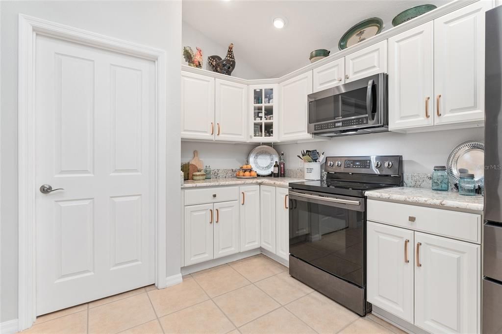 Another view of KITCHEN CABINET storage space - Door (L) leads to versatile OFFICE / INTERIOR LAUNDRY space.