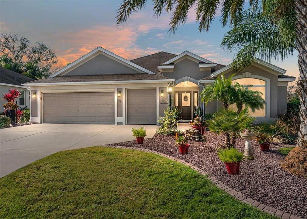 FRONT EXTERIOR @ Dusk - 525 Beaulieu Loop in the VILLAGE of AMELIA