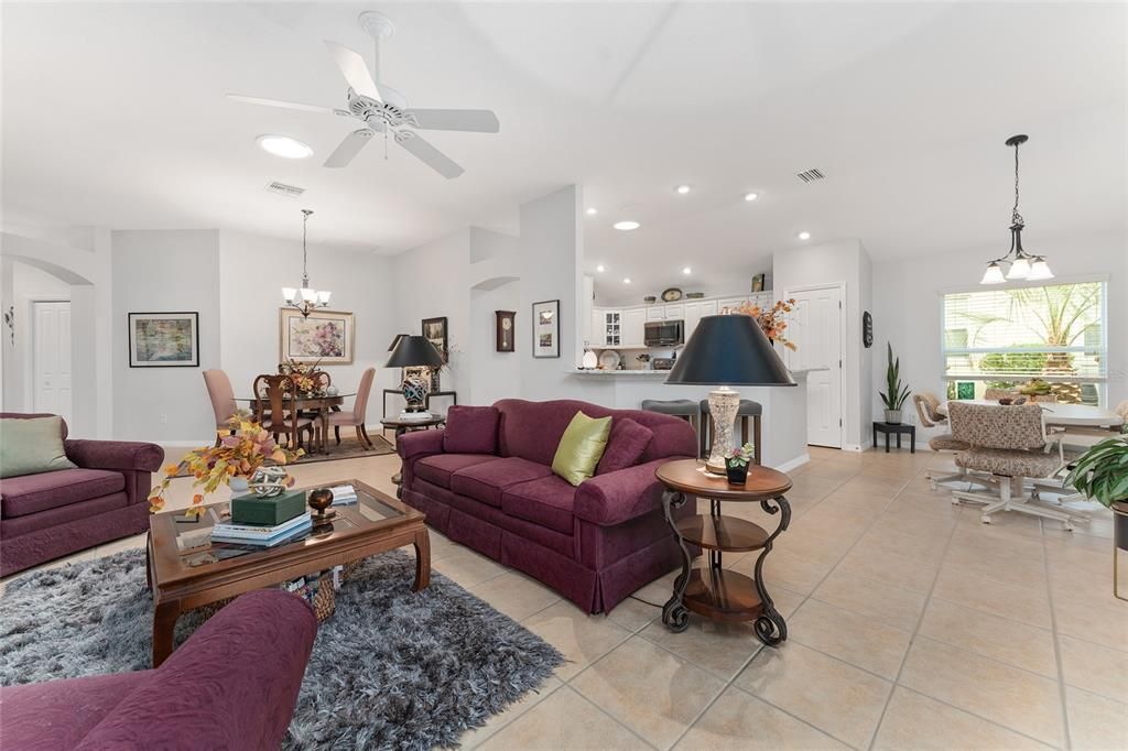 View from back corner of LIVING ROOM - FOYER (back L), DINING ROOM (back center), KITCHEN (back center R), BREAKFAST NOOK (far R), and LIVING ROOM (front center)