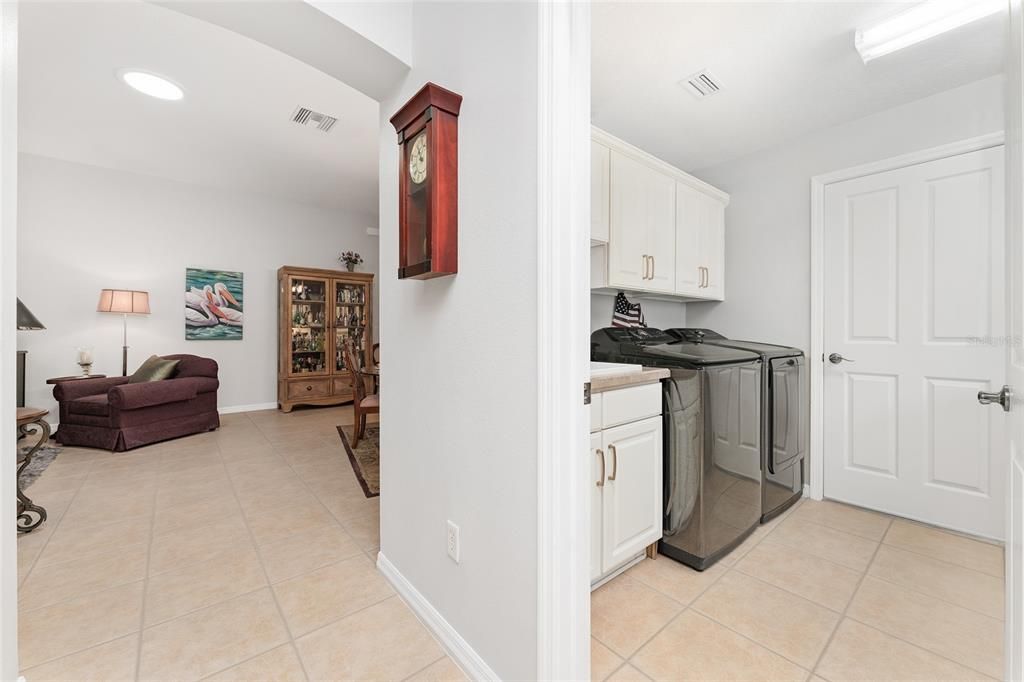 View of INTERIOR LAUNDRY ROOM from KITCHEN - Note that there is a door that swings inward on R