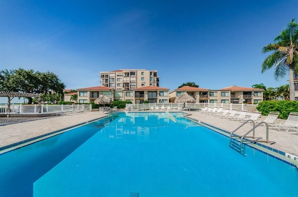 Beautiful heated pool right on the Bay