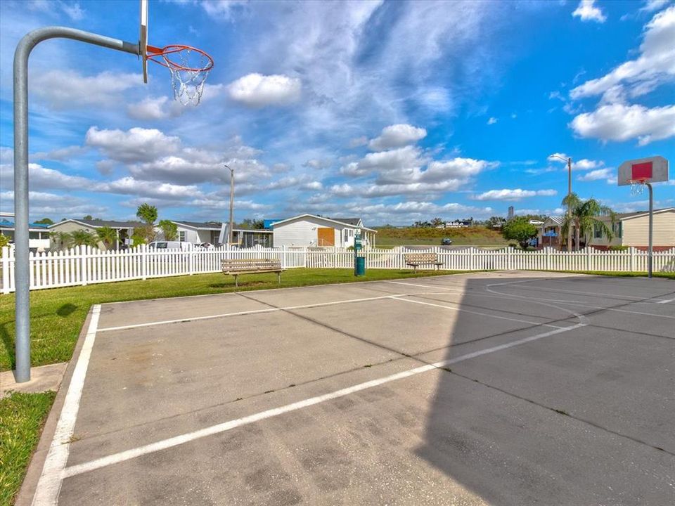 Fenced in Basketball Court adjacent to Clubhouse and Pool