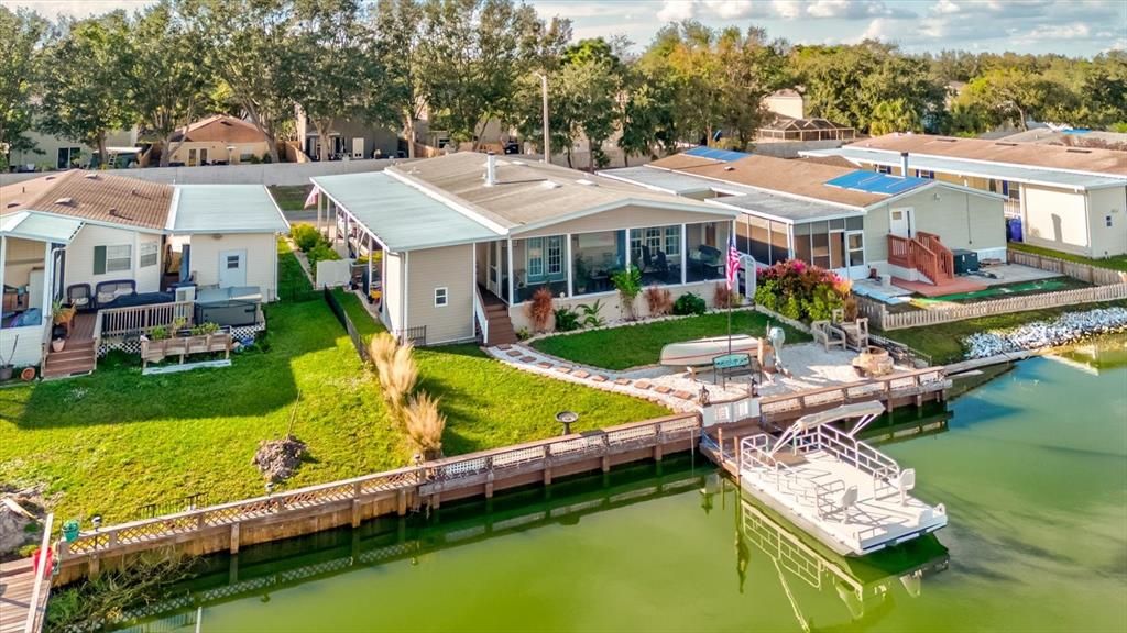 Pontoon Boat Docked in Backyard