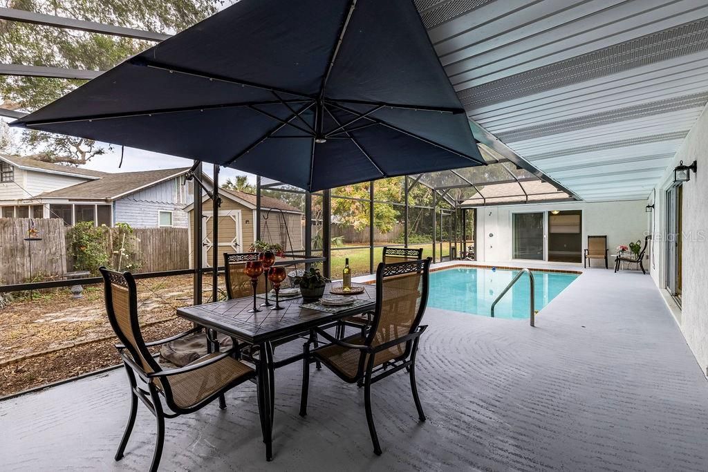 Fun sitting area. Even in the rain this awesome HUGE umbrella conveys keeping rain drops away!