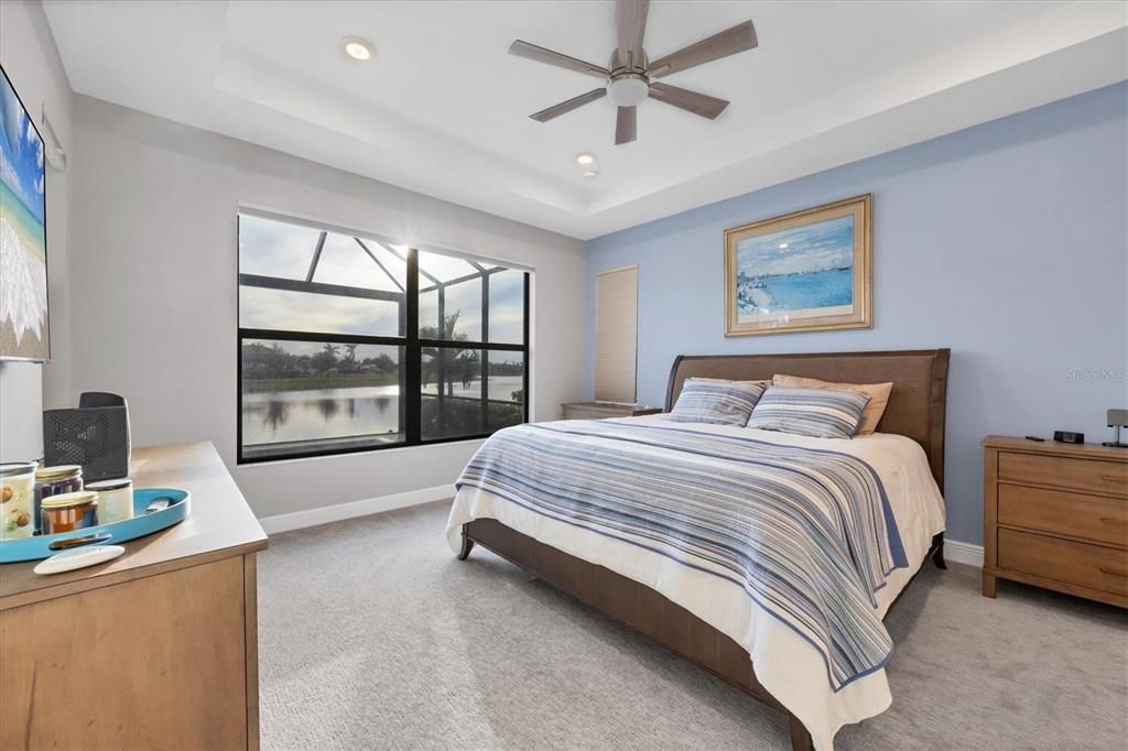 Master suite with views of the lake and upgraded designer carpeting with a thick lush padding