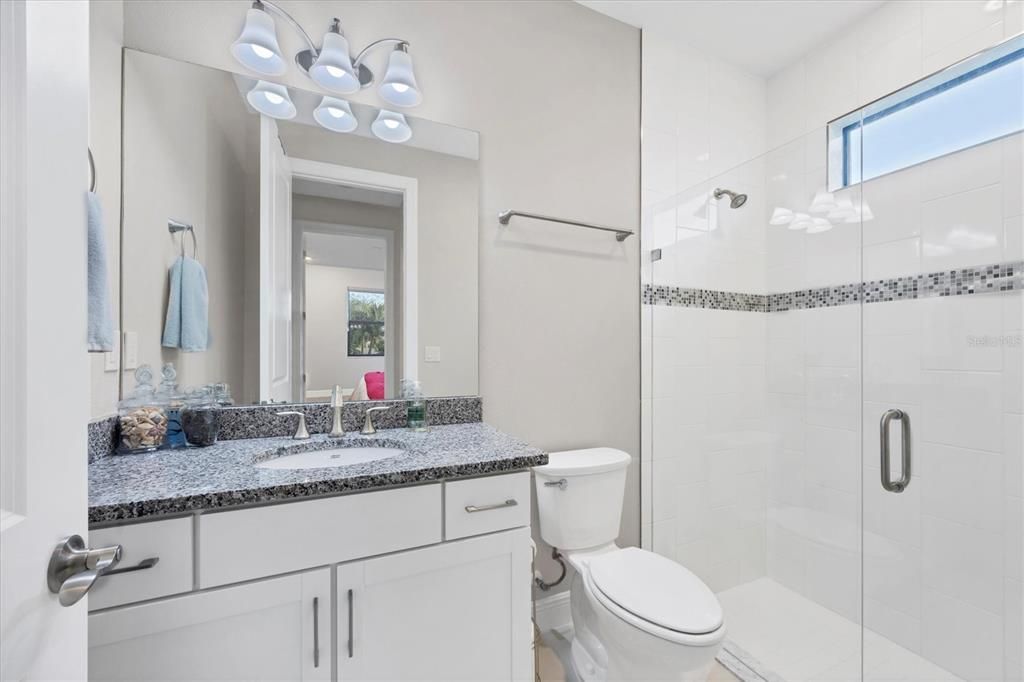 Guest bathroom with upgradedtiled shower